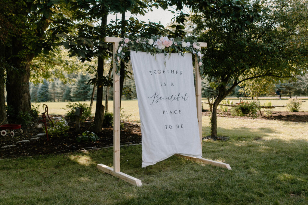 Handmade decorations adding a personal touch to a backyard wedding reception.