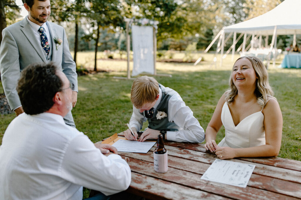 Couple's elopement celebration with friends and family in a backyard setting.