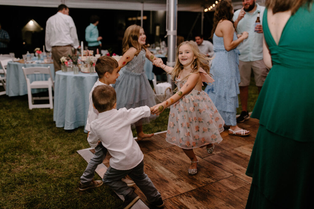 children dancing at intimate backyard wedding reception