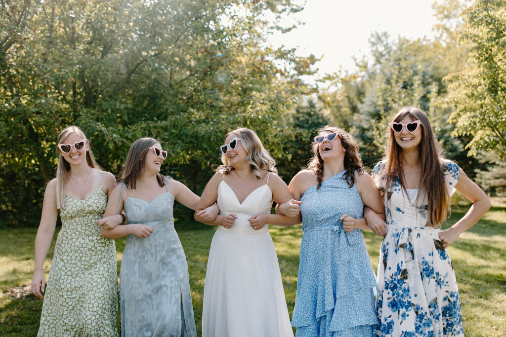 Bridal party smiling in Illinois backyard.