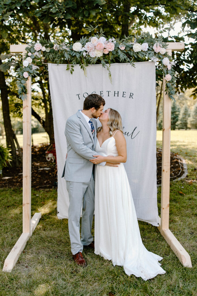 Couple celebrating their intimate backyard wedding reception in Illinois